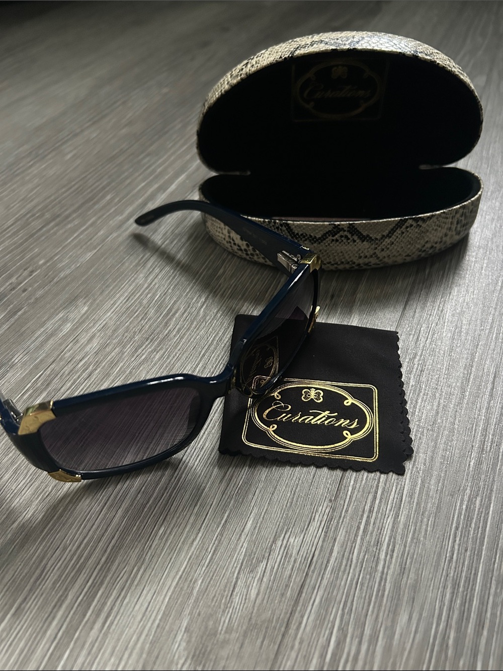 Curations Women’s Blue sunglasses with gold-tone corner accents